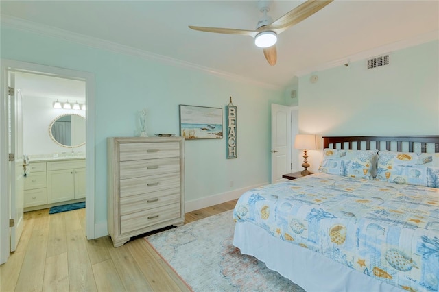 bedroom with light hardwood / wood-style floors, ensuite bath, ceiling fan, and crown molding