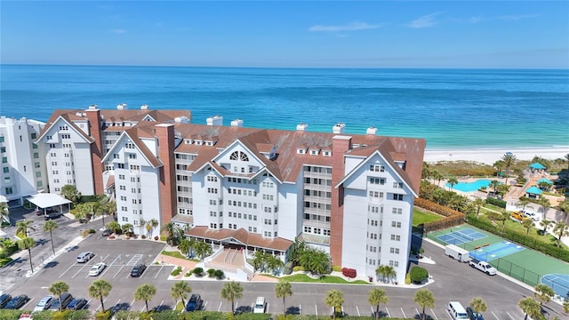 aerial view featuring a water view and a view of the beach