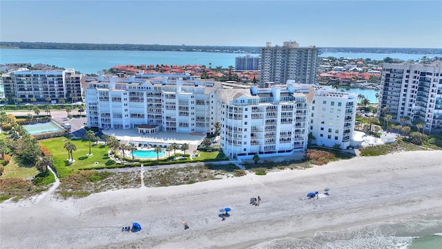 bird's eye view with a water view and a view of the beach