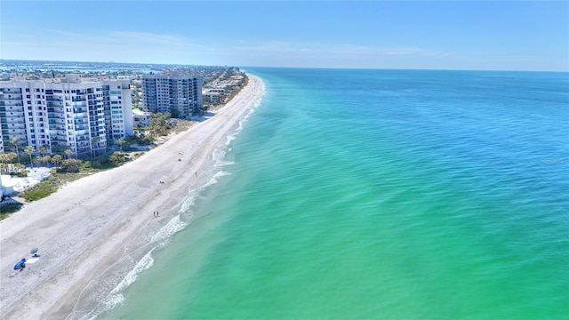 birds eye view of property with a beach view and a water view