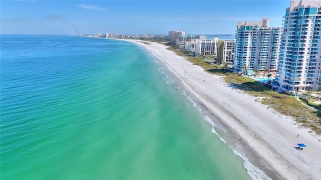 bird's eye view featuring a view of the beach and a water view