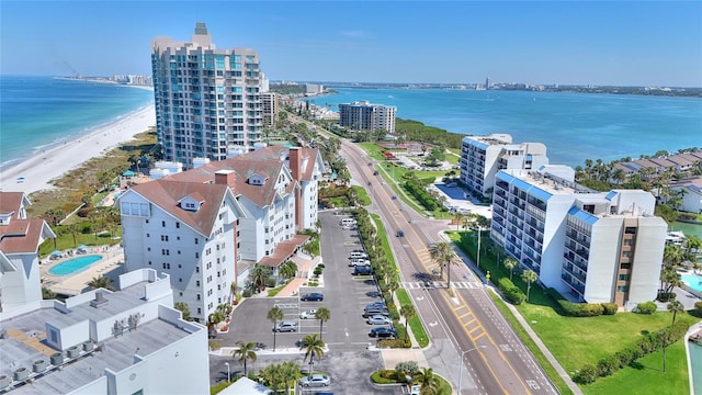 birds eye view of property with a view of the beach and a water view