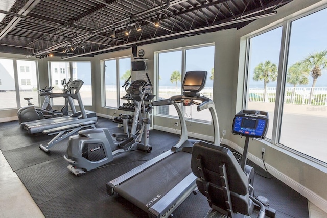 gym featuring a wealth of natural light and track lighting