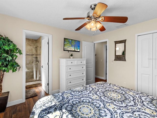 bedroom with a closet, ceiling fan, dark hardwood / wood-style floors, a textured ceiling, and ensuite bathroom