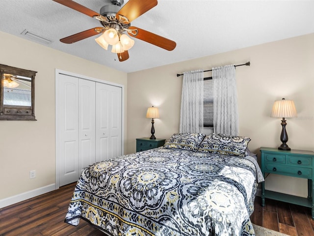 bedroom with ceiling fan, a closet, and dark hardwood / wood-style flooring