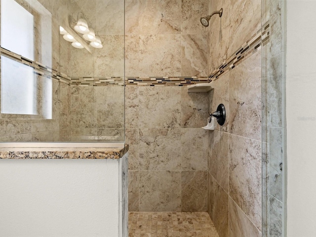 bathroom with tiled shower