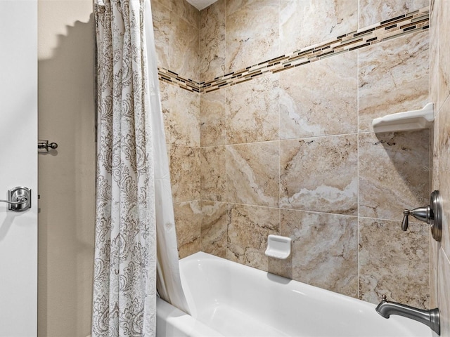 bathroom featuring shower / bathtub combination with curtain