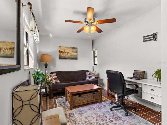 tiled office space with ceiling fan and plenty of natural light