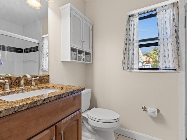 bathroom with toilet, an enclosed shower, vanity, and tile patterned floors