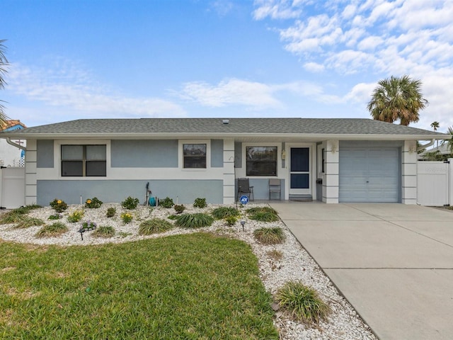 ranch-style home featuring a front yard and a garage