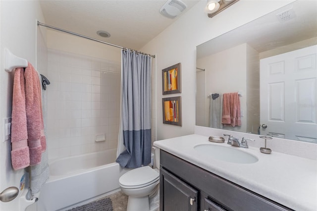 full bathroom with vanity, toilet, and shower / tub combo with curtain