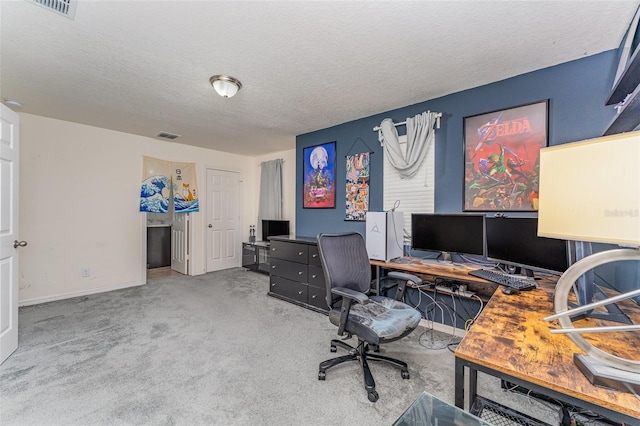 office space featuring carpet and a textured ceiling