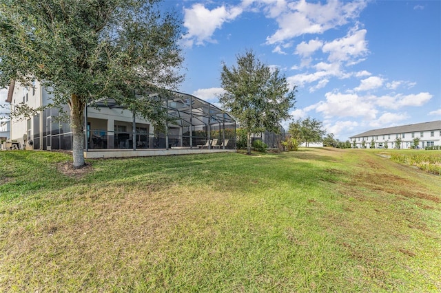 view of yard featuring glass enclosure