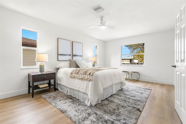 bedroom featuring light wood-type flooring and ceiling fan