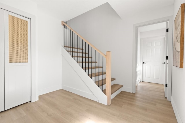 stairway featuring wood-type flooring