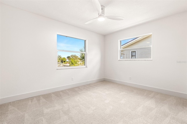 carpeted empty room with ceiling fan