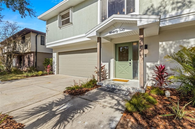 view of exterior entry with a garage