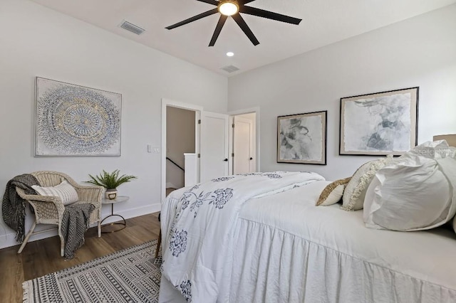 bedroom with dark wood-type flooring and ceiling fan