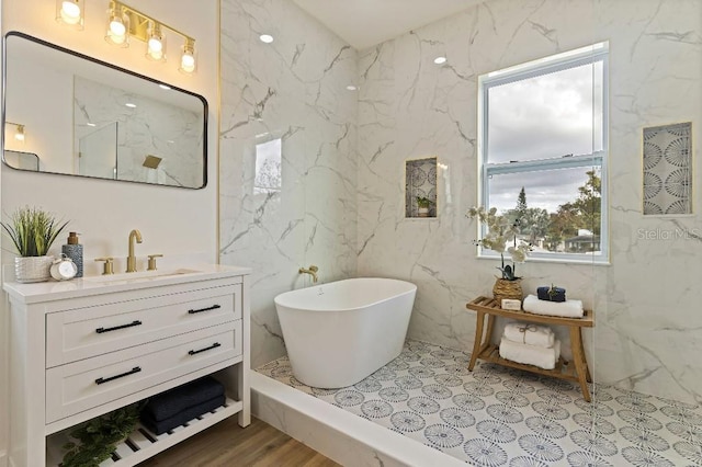 bathroom featuring vanity and a bathing tub