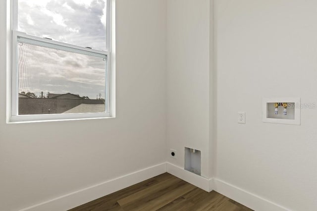 laundry room with electric dryer hookup, hookup for a washing machine, and dark hardwood / wood-style floors