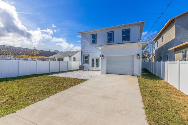 view of front of house featuring central AC, a front yard, french doors, and a patio area