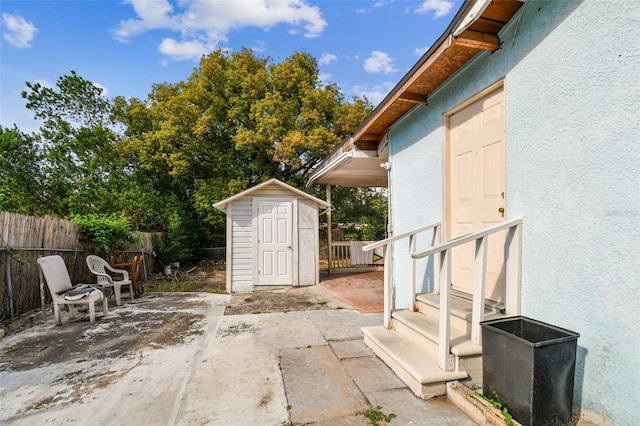 view of patio with a storage shed