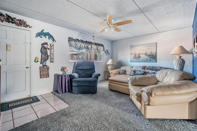 tiled living room with ceiling fan