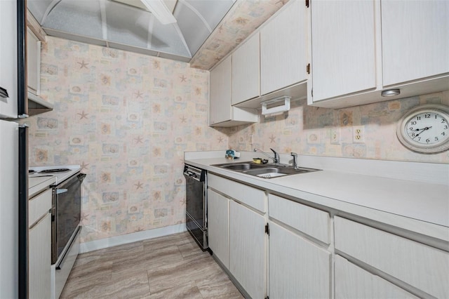 kitchen with black dishwasher, white cabinetry, sink, and electric range oven