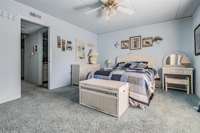 bedroom featuring carpet flooring, a ceiling fan, and visible vents