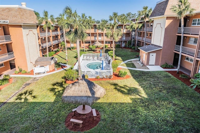 surrounding community with a lawn and a residential view