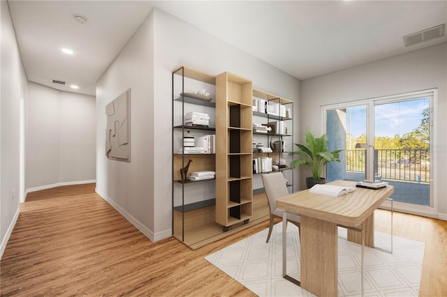 home office with light wood-type flooring