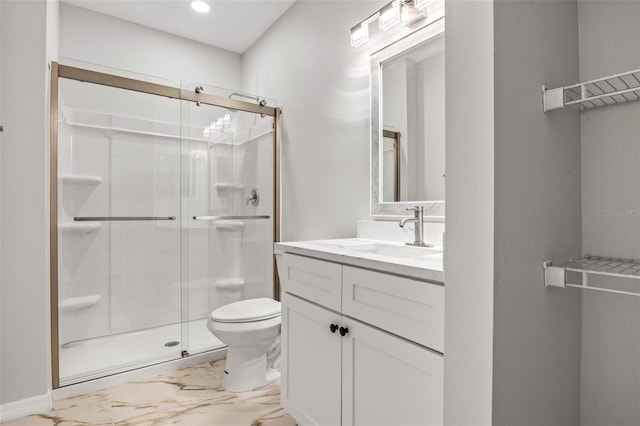 bathroom with vanity, toilet, and walk in shower