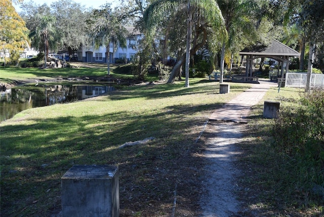 surrounding community with a lawn and a gazebo