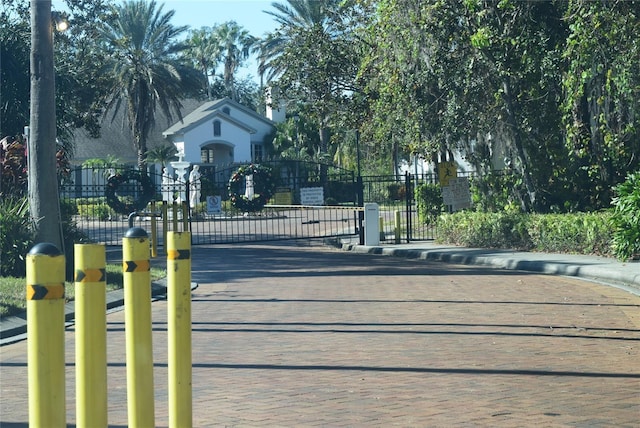 view of gate featuring fence