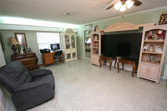 living room with a textured ceiling, ceiling fan, ornamental molding, and built in shelves