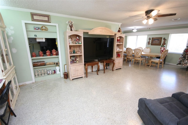 living room featuring ceiling fan, crown molding, and a textured ceiling