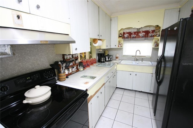 kitchen featuring white cabinets, black appliances, sink, light tile patterned floors, and crown molding