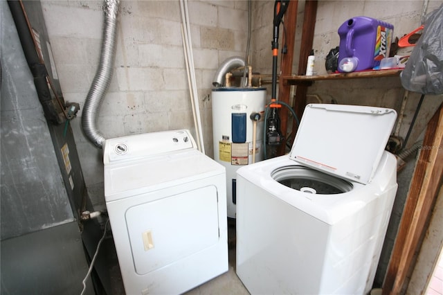 washroom featuring washing machine and clothes dryer and electric water heater