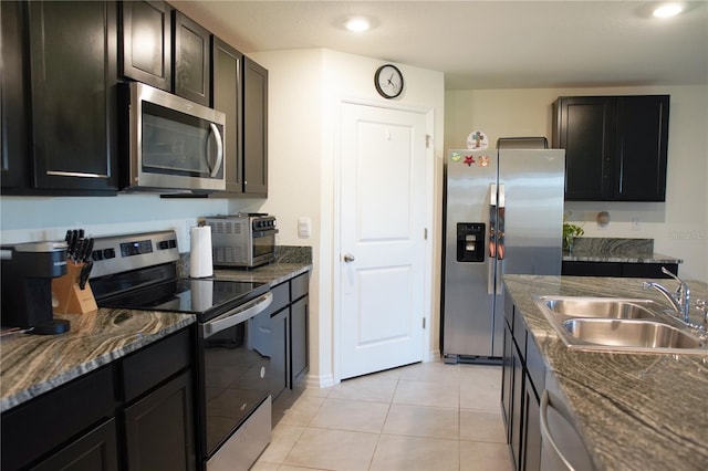 4694 Sigcom Pl, Wildwood, FL 34785 - kitchen with appliances with stainless steel finishes and light tile patterned flooring