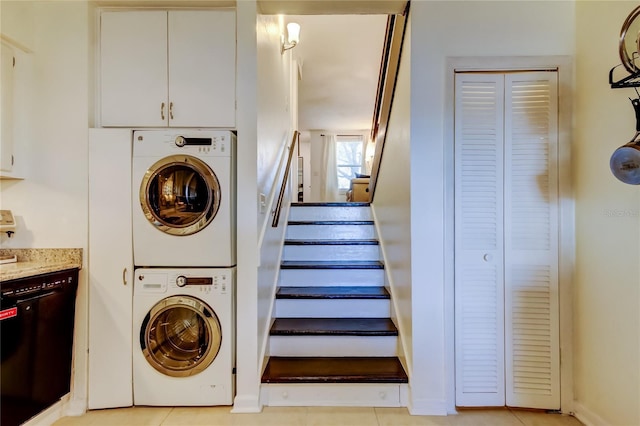 laundry room with stacked washer and dryer