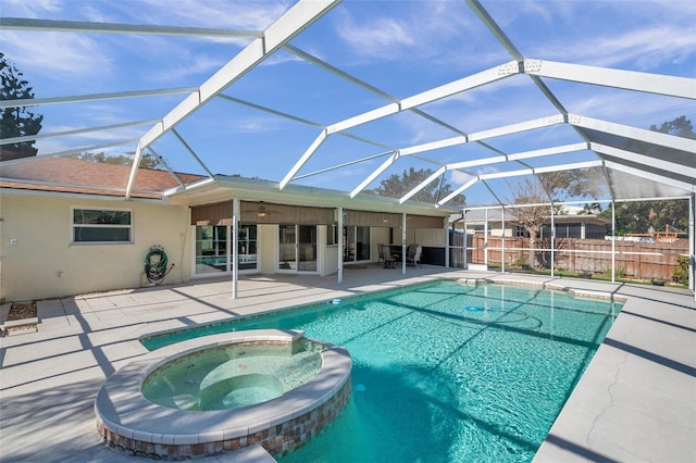 view of swimming pool with a lanai, an in ground hot tub, and a patio