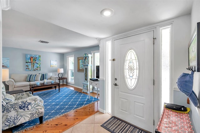 foyer featuring light tile patterned floors