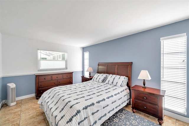 bedroom with light tile patterned floors