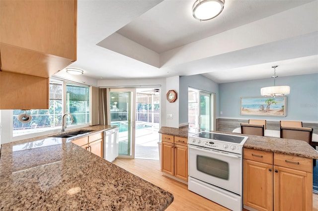 kitchen featuring light stone countertops, stainless steel dishwasher, sink, light hardwood / wood-style floors, and white range with electric cooktop