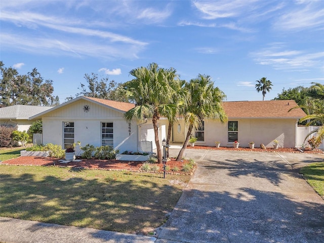 ranch-style house with a front yard