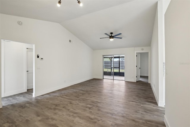 spare room featuring ceiling fan, dark hardwood / wood-style flooring, and lofted ceiling