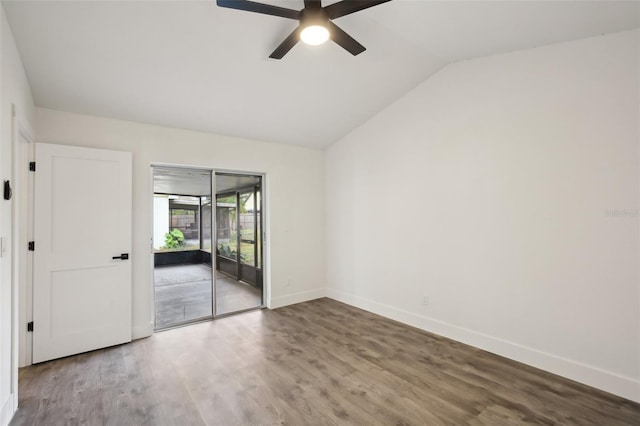 spare room with hardwood / wood-style floors, ceiling fan, and lofted ceiling