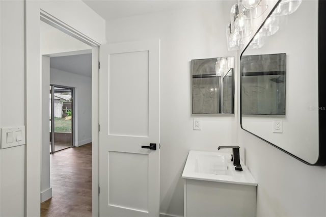 bathroom with vanity and wood-type flooring