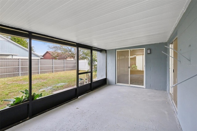 unfurnished sunroom featuring a wealth of natural light