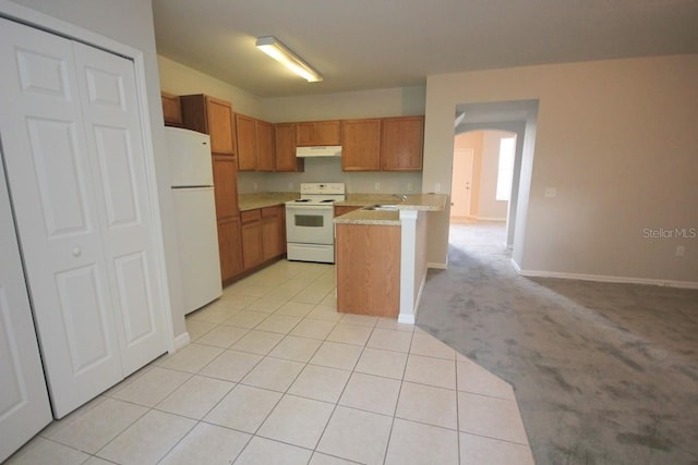 kitchen featuring light carpet, white appliances, kitchen peninsula, and sink